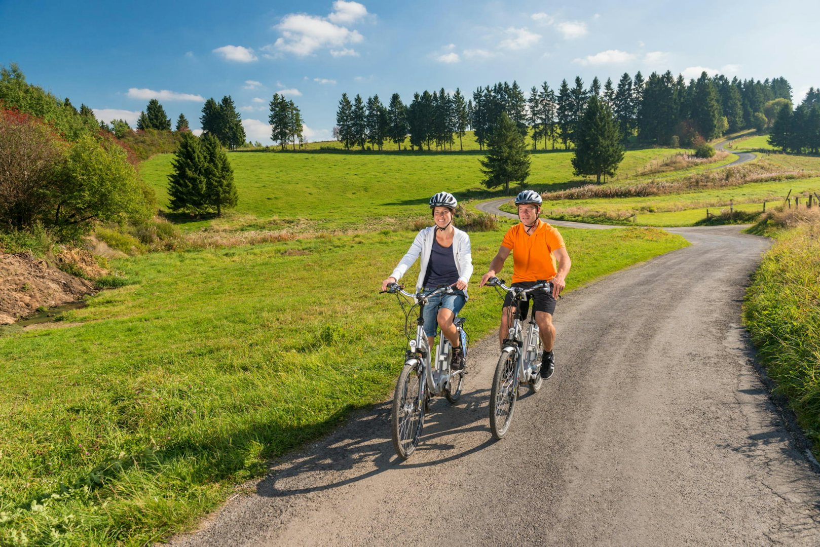 a couple cycling through one of the Vennbahn loops